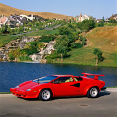 LAM 01 RK0384 02
Lamborghini Countach Red Side 3/4 View On Pavement By Water And Hills