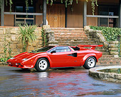 LAM 01 RK0422 01
Lamborghini Countach Red 3/4 Side View On Driveway By Fountain And House