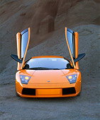 LAM 01 RK0486 03
2002 Lamborghini Murcielago Orange Head On View On Gravel