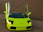 LAM 01 RK0591 01
2006 Lamborghini Murcielago Roadster Lime Green Head On View On Sand