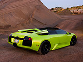 LAM 01 RK0596 01
2006 Lamborghini Murcielago Roadster Lime Green 3/4 Rear View On Sand