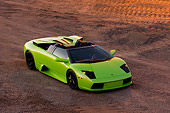 LAM 01 RK0601 01
2006 Lamborghini Murcielago Roadster Lime Green Overhead 3/4 Front View On Sand