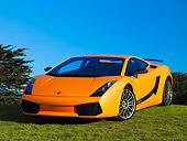 LAM 01 RK0633 02
2007 Lamborghini Gallardo Superleggera Orange With Black Stripe Front 3/4 View On Grass Blue Sky