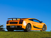 LAM 01 RK0635 01
2007 Lamborghini Gallardo Superleggera Orange With Black Stripe Rear 3/4 View On Grass Blue Sky
