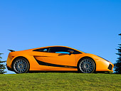 LAM 01 RK0636 02
2007 Lamborghini Gallardo Superleggera Orange With Black Stripe 3/4 Front View On Grass Blue Sky