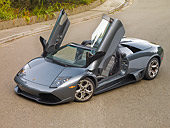 LAM 01 RK0659 01
2008 Lamborghini Murcielago LP640 Roadster Gray 3/4 Front View On Pavement