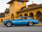 LAM 01 RK0687 01
1965 First Lamorghini 350GT Azure Blue Profile View On Pavement By Building