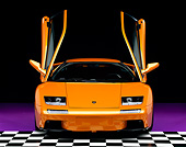 LAM 02 RK0147 08
2001 Lamborghini Diablo 6L Orange Head On Shot Checkered Floor Studio