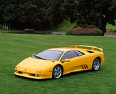 LAM 02 RK0019 02
1994 Lamborghini Diablo Special Edition 30th Anniversary Yellow 3/4 Front View On Grass Trees Background