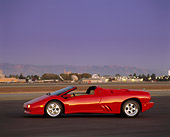 LAM 02 RK0034 01
1996 Lamborghini Diablo Roadster 3/4 Front View On Pavement At Dusk