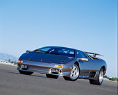 LAM 02 RK0053 03
1995 Lamborghini Diablo VT Silver Low Slanted 3/4 Front View On Pavement Blue Sky