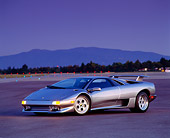 LAM 02 RK0058 06
1995 Lamborghini Diablo VT Silver 3/4 Front View On Pavement At Night
