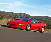 LAM 02 RK0076 21
1991 Lamborghini Diablo Red Low 3/4 Side On Pavement Mountains And Blue Sky