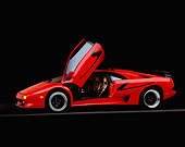 LAM 02 RK0087 06
1998 Lamborghini Diablo SV Red 3/4 Side View On Gray Line Studio