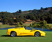 LAM 02 RK0095 05
1995 Lamborghini Diablo VT Roadster Yellow Profile View On Grass By Lake And Trees Blue Sky