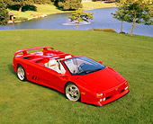 LAM 02 RK0103 10
1995 Lamborghini Diablo Roadster 30th Anniversary Edition Red Overhead 3/4 Front View On Grass By Lake
