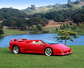 LAM 02 RK0106 02
1995 Lamborghini Diablo Roadster 30th Anniversary Edition Red 3/4 Side View On Grass By Lake