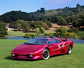 LAM 02 RK0113 01
1998 Lamborghini Diablo SV Custom Purple 3/4 Front View On Grass By Lake