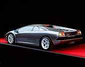 LAM 02 RK0139 06
2001 Lamborghini Diablo 6L Gray 3/4 Rear View On Red Floor Studio
