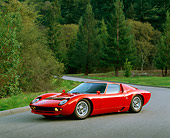 LAM 03 RK0014 01
1970 Lamborghini Miura S Red 3/4 Side View On Pavement By Trees