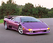 LAM 04 RK0008 01
1994 Lamborghini Diablo 30th Anniversary Edition Purple Front 3/4 View On Pavement By Trees