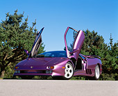 LAM 04 RK0015 03
1994 Lamborghini Diablo 30th Anniversary Edition Purple Low 3/4 Front View On Pavement Blue Sky