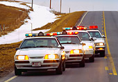 LAW 01 RK0004 01
Nebraska Police Cars In A Row On Road Lights On At Dusk