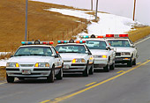 LAW 01 RK0004 04
Nebraska Police Cars In A Row On Road Lights On At Dusk