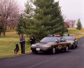 LAW 01 RK0008 04
Ohio State Highway Patrol Officers And Police Dog By 1994 Ford Crown Victoria