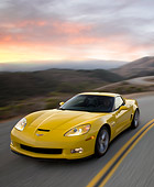 VET 01 RK0905 02
2009 Chevrolet Corvette Z06 Yellow Driving On Highway At Dusk