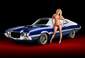 WMN 03 RK0308 01
1972 Ford Torino Blue 3/4 Front View In Studio With Swimsuit Model