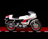 MOT 01 RK0377 01
1974 John Player Norton 850 Motorcycle Side View On Red Floor Checkered Line Studio