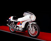 MOT 01 RK0380 11
1974 John Player Norton 850 Motorcycle 3/4 Front View On Red Floor Gray Line Studio