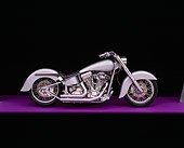 MOT 01 RK0427 08
2003 Softail Custom Motorcycle Silver Side View On Purple Floor Studio