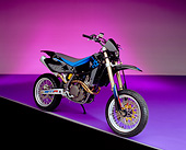 MOT 01 RK0512 08
2004 Husquvarna SMR 450 Black And Blue 3/4 Front View On Purple Floor And Lighting Studio