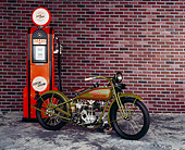 MOT 01 RK0084 02
1926 Harley Davidson single cylinder racer, slight 3/4 front on mottled floor with brick wall and gas pump