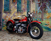 MOT 01 RK0283 03
1943 80 Flathead UL Red 3/4 Front View On Cobblestone By Cottage