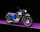 MOT 01 RK0382 02
1962 Triumph T100SS Motorcycle Blue 3/4 Side View On Purple Floor Studio
