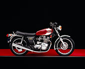 MOT 01 RK0554 02
1975 Triumph Trident Maroon And White Side View On Red Floor Gray Line Studio