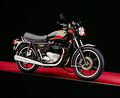 MOT 01 RK0558 06
1983 Trident TSS Black And Red 3/4 Side View On Red Floor Gray Line Studio