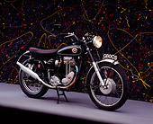 MOT 01 RK0570 03
1954 Matchless G80CS Black Side 3/4 View On Gray Floor Splattered Paint Background