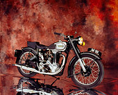 MOT 01 RK0578 06
1947 Norton Model 18 Black And Chrome 3/4 Side View On Mylar Floor Brown Mottled Background Studio