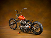MOT 01 RK0728 01
2006 Kraus Thirty Sixty Orange Motorcycle 3/4 Rear View Brown Mottled Studio