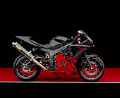 MOT 02 RK0195 02
2003 Yamaha R6 LE Black With Red Flames Side View On Red Floor Gray Line Studio