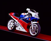 MOT 02 RK0215 01
1990 Honda RC30 Red White And Blue 3/4 Side View On Red Floor Gray Line Studio
