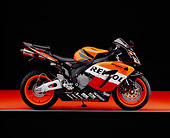 MOT 02 RK0240 02
2005 Honda CBR 1000RR Repsol Orange And Red Profile View On Orange Floor Studio