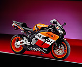 MOT 02 RK0242 10
2005 Honda CBR 1000RR Repsol Orange And Red 3/4 Side View On Red Floor Gray Line Studio