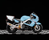 MOT 02 RK0248 04
1999 Honda CBR 900RR Light Blue Profile View On Checkered Floor Studio