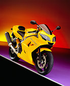 MOT 02 RK0269 08
2005 Triumph Daytona 350 Yellow 3/4 Front View On Purple Floor Colorful Background Studio
