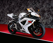 MOT 02 RK0301 06
2006 Suzuki GSXR 600 Silver And White 3/4 Side View On Red Floor Gray Marble Studio